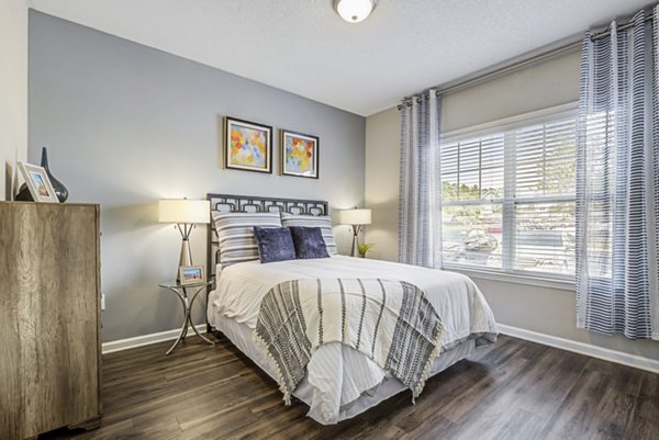 Modern bedroom featuring elegant furnishings at Avant at Steele Creek luxury apartments
