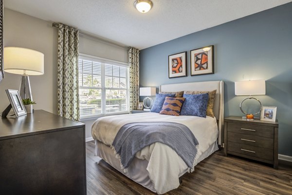 Luxurious bedroom with elegant furnishings at Avant at Steele Creek apartments
