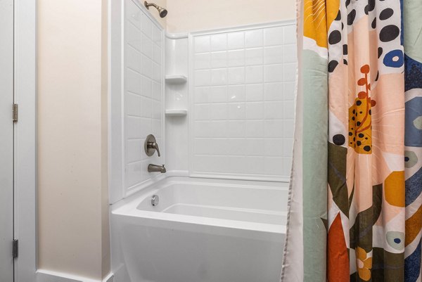 Bathroom featuring modern fixtures and elegant marble countertops in Encore at Heritage Apartments