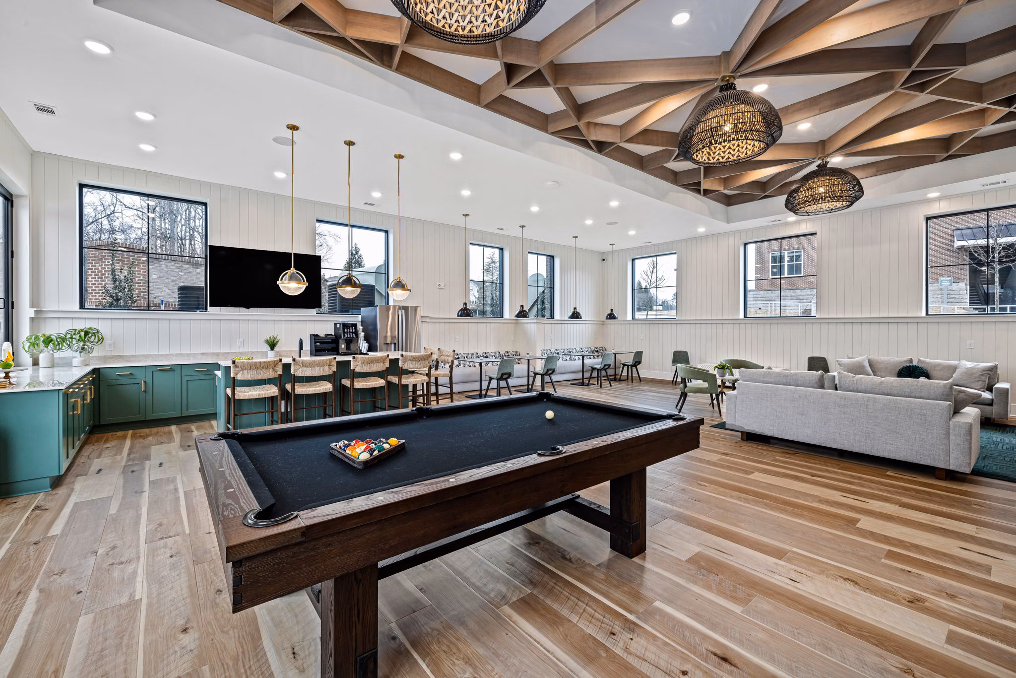 Clubhouse featuring modern design and plush seating at Encore at Heritage Luxury Apartments