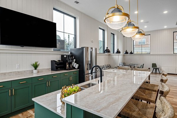 Luxurious clubhouse with modern seating and lounge area at Encore at Heritage Apartments, offering a premium experience for residents