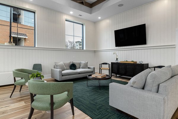 Clubhouse featuring modern design and cozy seating areas at Encore at Heritage Apartments