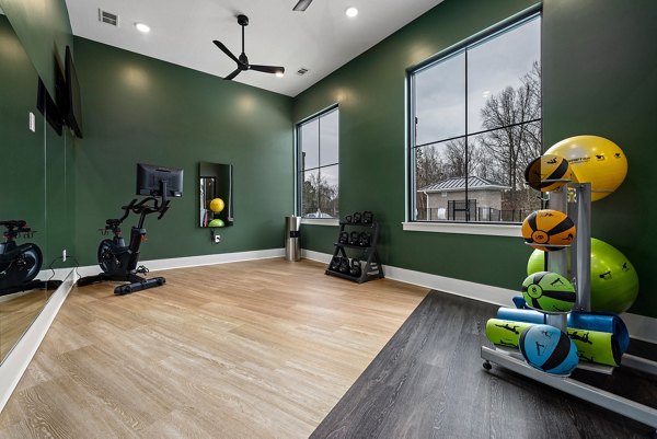 Yoga/spin studio with modern equipment at Encore at Heritage Apartments, luxury living spaces by Greystar