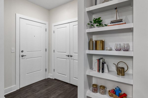 Elegant hallway with modern lighting at Encore at Heritage Apartments, showcasing luxury living spaces
