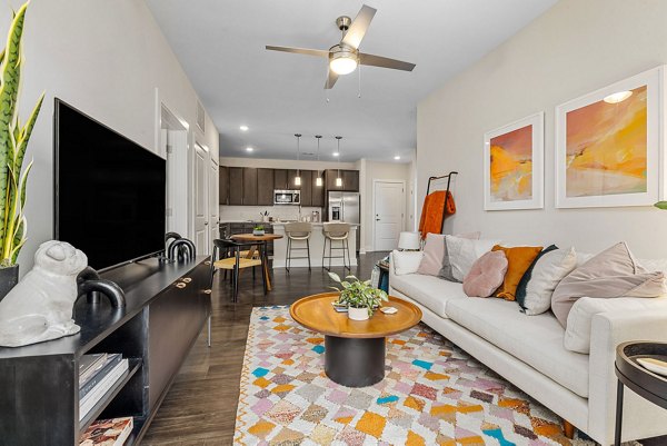 Elegant living room with modern furnishings at Encore at Heritage Apartments, a luxury community