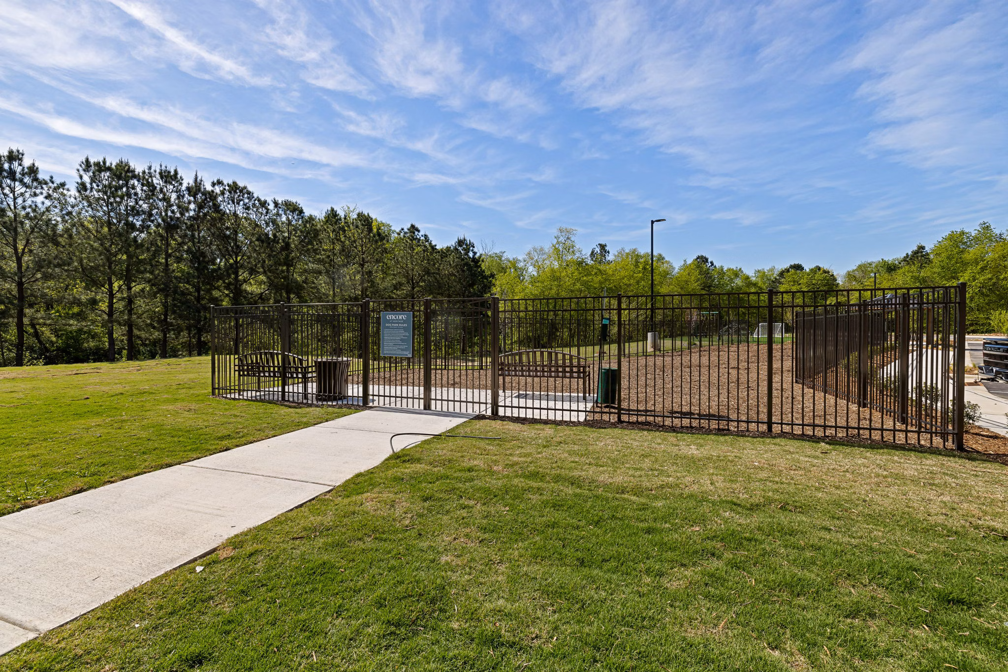 Dog park with agility equipment at Encore at Heritage Apartments, a Greystar community offering luxury pet-friendly amenities