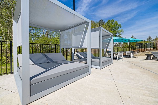Outdoor patio with stylish seating at Encore at Heritage Apartments