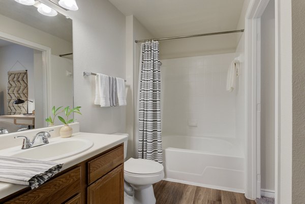 Modern bathroom with sleek fixtures at Sendero Ridge Apartments featuring luxury design elements