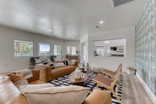 Clubhouse at Sendero Ridge Apartments: Modern space featuring luxurious seating areas and billiards table