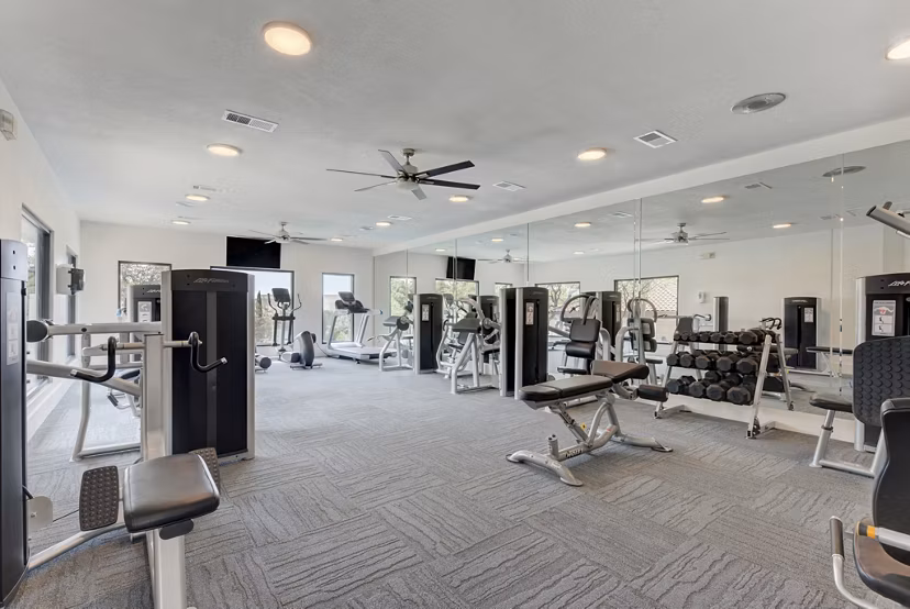 Modern fitness center equipped with state-of-the-art machines at Sendero Ridge Apartments