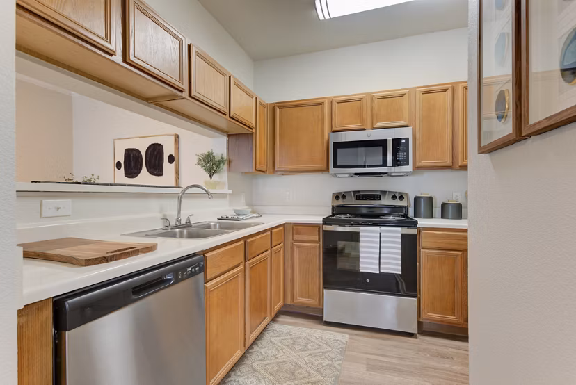 Modern kitchen with stainless steel appliances at Sendero Ridge Apartments