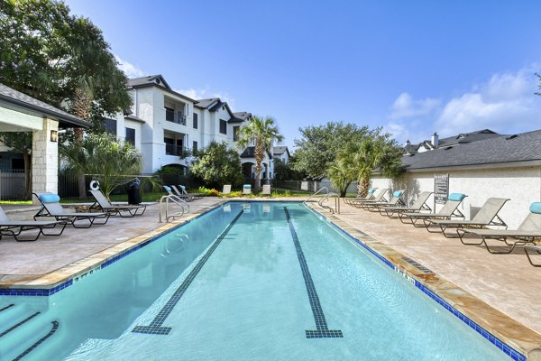 Rooftop pool with mountain views at Sendero Ridge Apartments