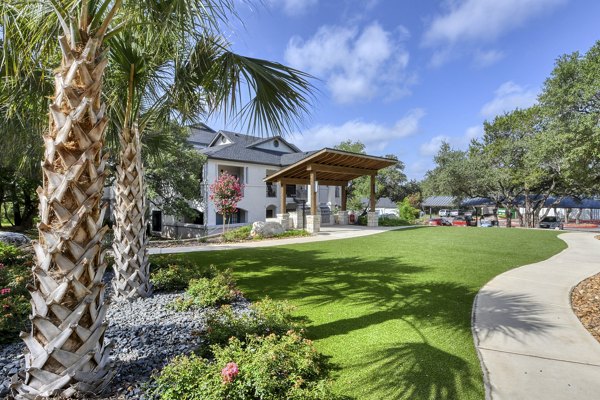 Colorful playground with slides and swings at Sendero Ridge Apartments offering family-friendly amenities