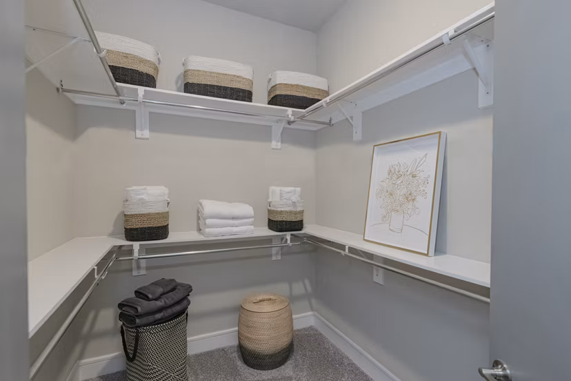 Spacious walk-in closet with built-in storage at Canal 1535 Apartments