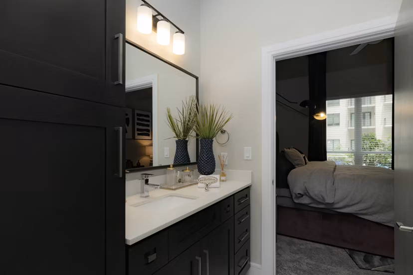 Luxurious bathroom with modern fixtures at Canal 1535 Apartments, featuring sleek design and upscale amenities for a comfortable living experience