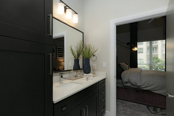 Luxurious bathroom with modern fixtures at Canal 1535 Apartments, featuring sleek design and upscale amenities for a comfortable living experience