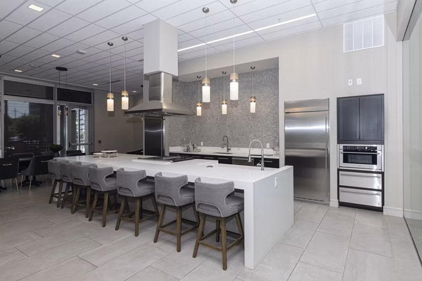Clubhouse featuring modern seating and entertainment amenities at Canal 1535 Apartments in downtown urban setting