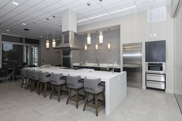 Clubhouse featuring modern seating and entertainment amenities at Canal 1535 Apartments in downtown urban setting