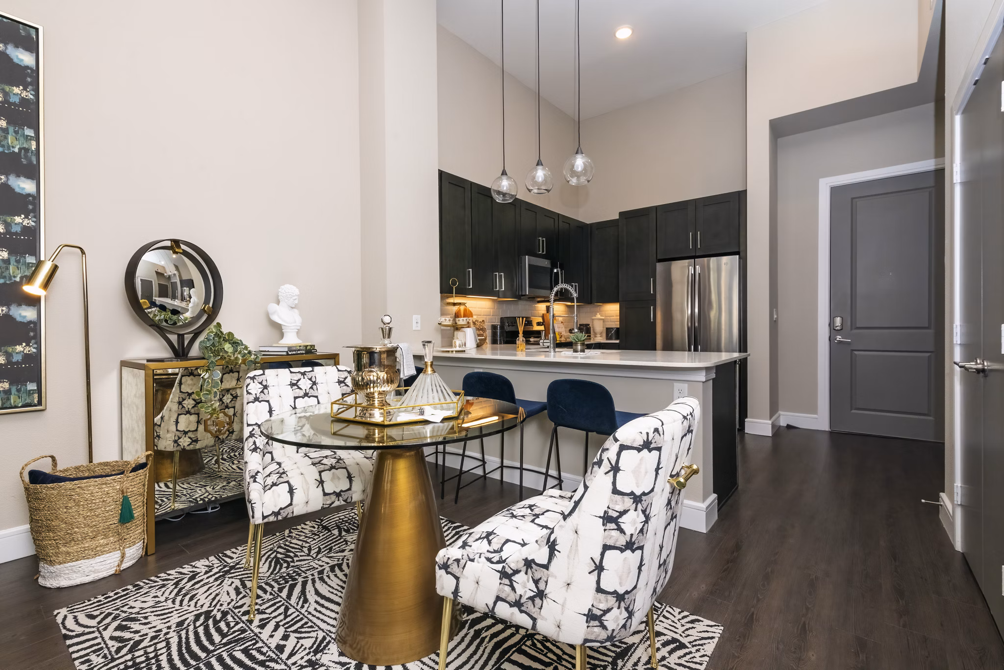 Dining area featuring sleek modern furniture and ambient lighting at Canal 1535 Apartments