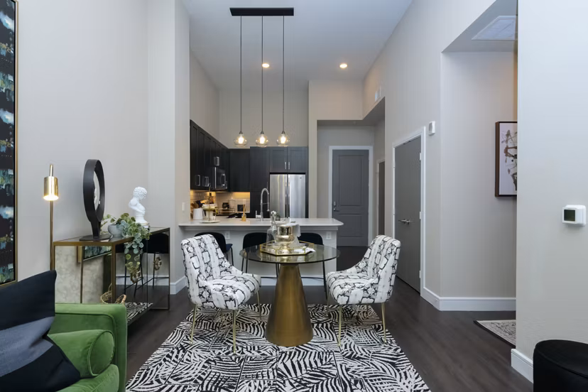 Dining area with modern furnishings and ample natural light at Canal 1535 Apartments, luxury living in New Orleans