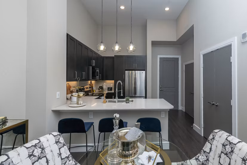 Dining area with modern decor and sleek lighting in Canal 1535 Apartments