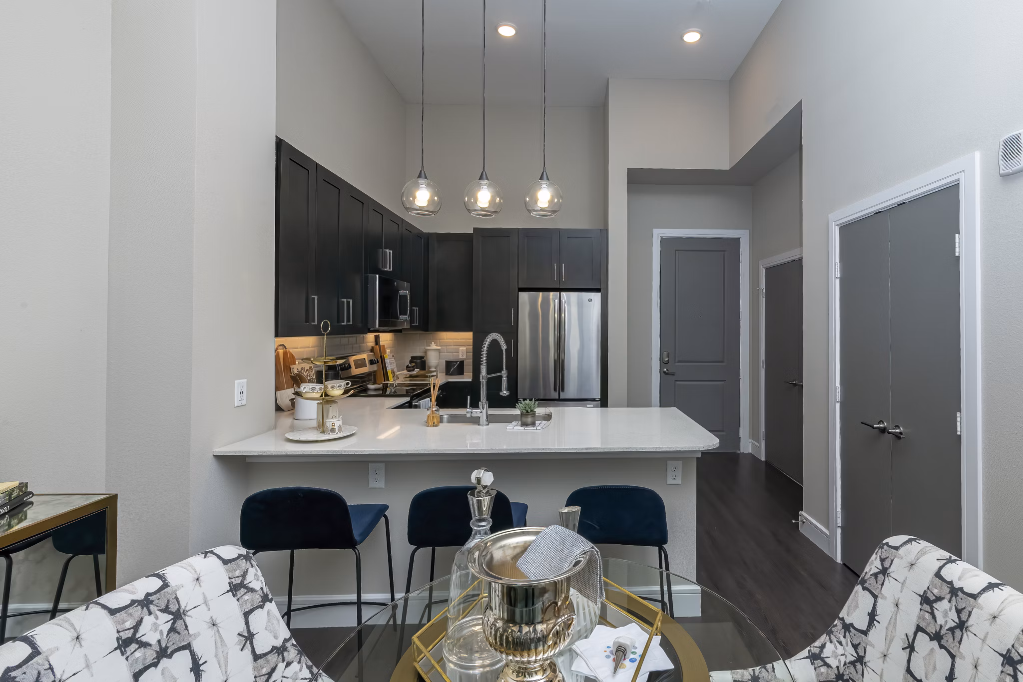 Dining area with modern decor and sleek lighting in Canal 1535 Apartments