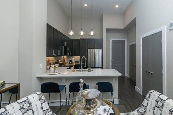 Dining area with modern decor and sleek lighting in Canal 1535 Apartments