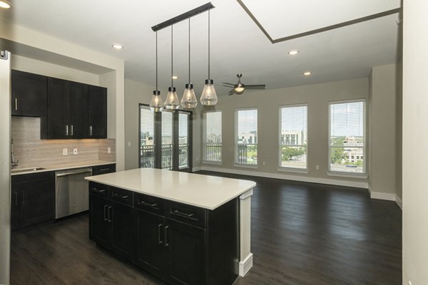 Modern kitchen featuring stainless steel appliances and sleek countertops at Canal 1535 Apartments