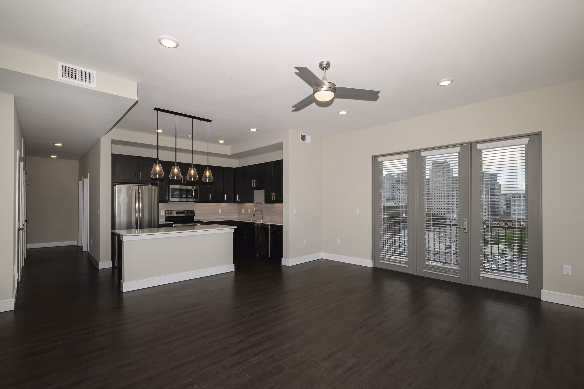 Modern living room with sleek furnishings and large windows at Canal 1535 Apartments, luxury living in a prime neighborhood