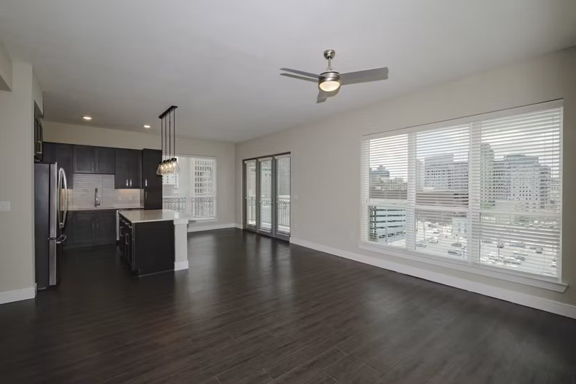 Elegant living room with modern furnishings at Canal 1535 Apartments, featuring cozy ambiance and stylish decor