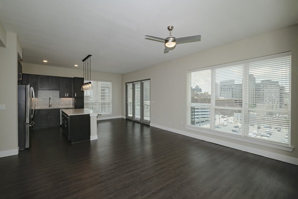 Elegant living room with modern furnishings at Canal 1535 Apartments, featuring cozy ambiance and stylish decor