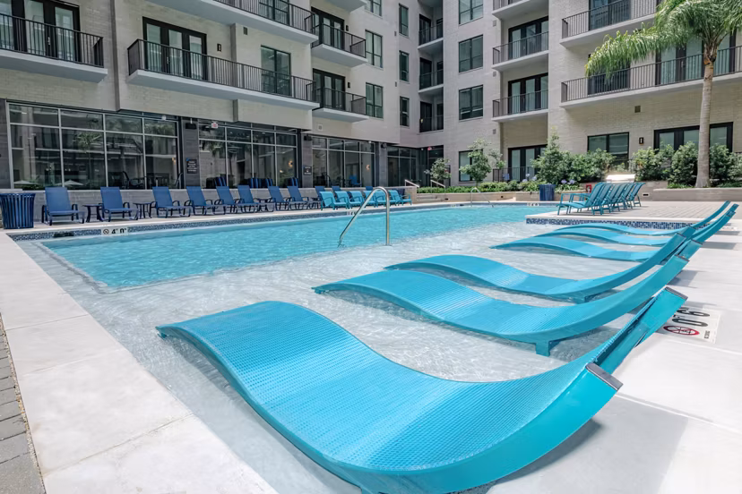 Rooftop pool with city skyline views at Canal 1535 Apartments