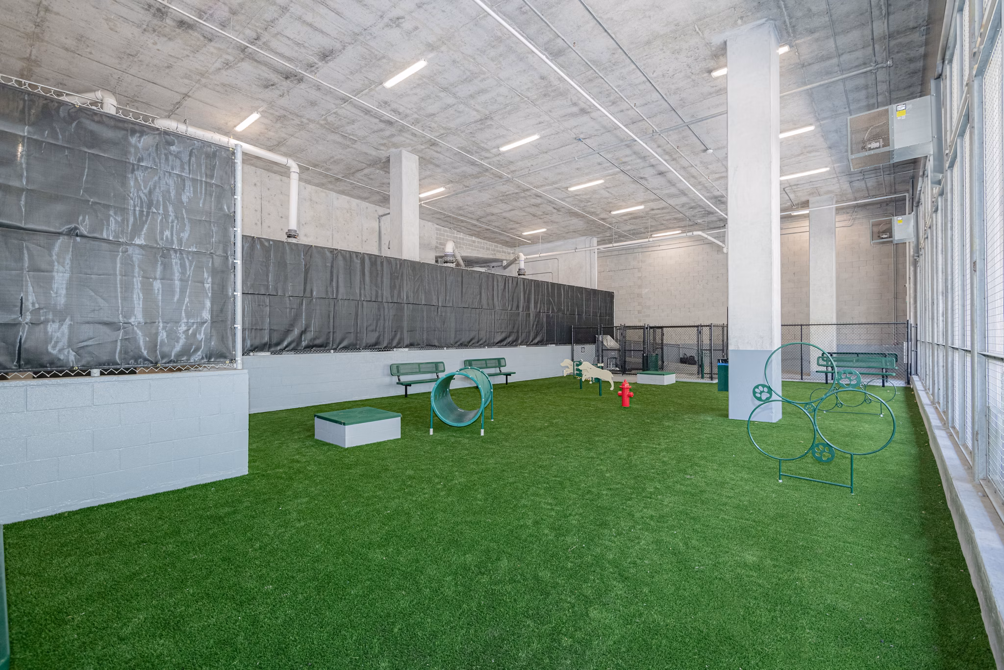 Dog park with modern amenities at Canal 1535 Apartments, perfect for pet owners in a vibrant community setting