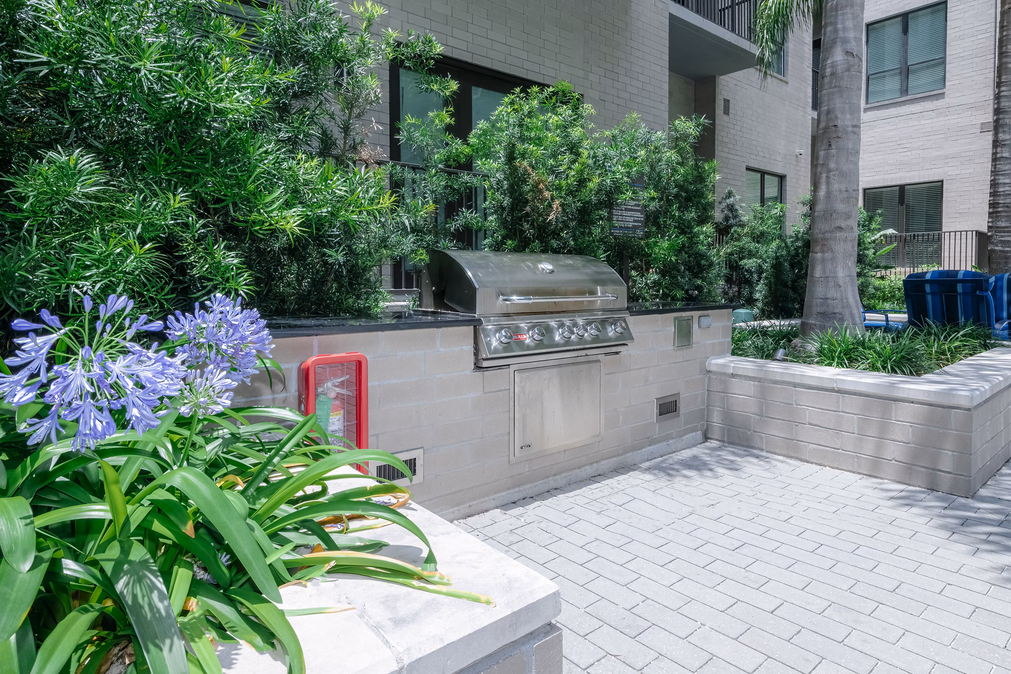 Outdoor grill area with stainless steel appliances at Canal 1535 Apartments, ideal for residents' social gatherings and barbecues