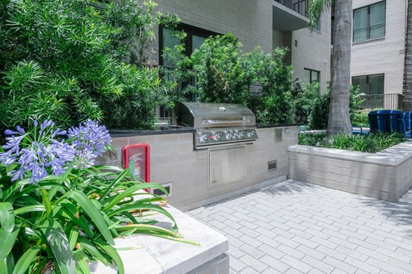 Outdoor grill area with stainless steel appliances at Canal 1535 Apartments, ideal for residents' social gatherings and barbecues