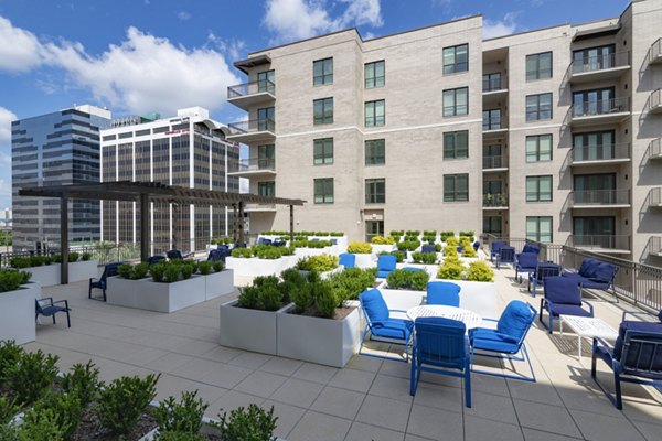 Pet-friendly dog park at Canal 1535 Apartments with agility course and seating area