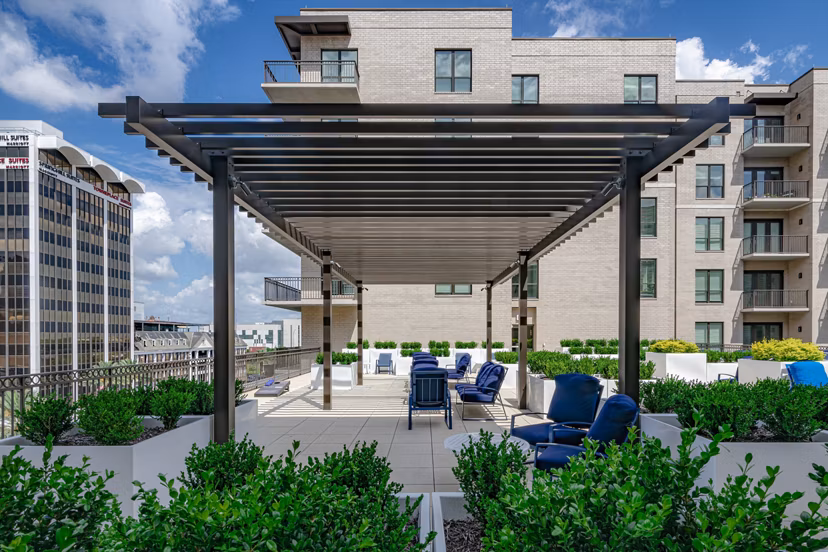 Charming courtyard with lush greenery at Canal 1535 Apartments: Modern luxury living in the heart of a vibrant community