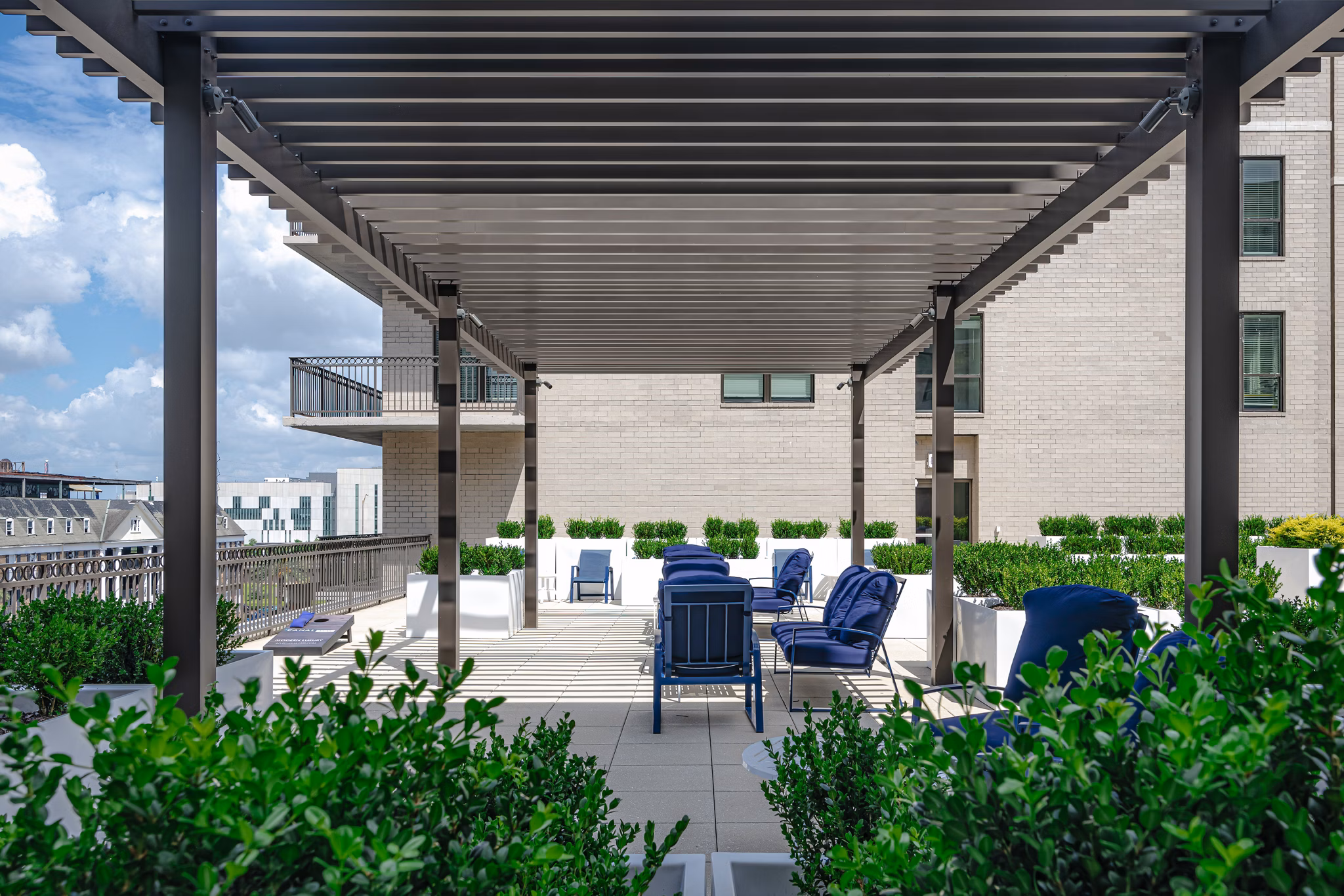 Courtyard with modern seating and lush greenery at Canal 1535 Apartments
