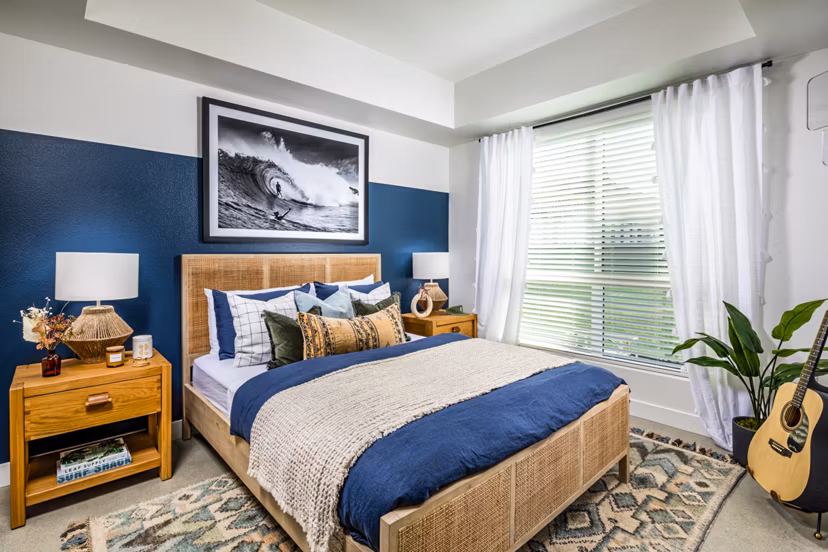 Cozy bedroom with modern furnishings at Silo Apartments, a luxury Greystar community