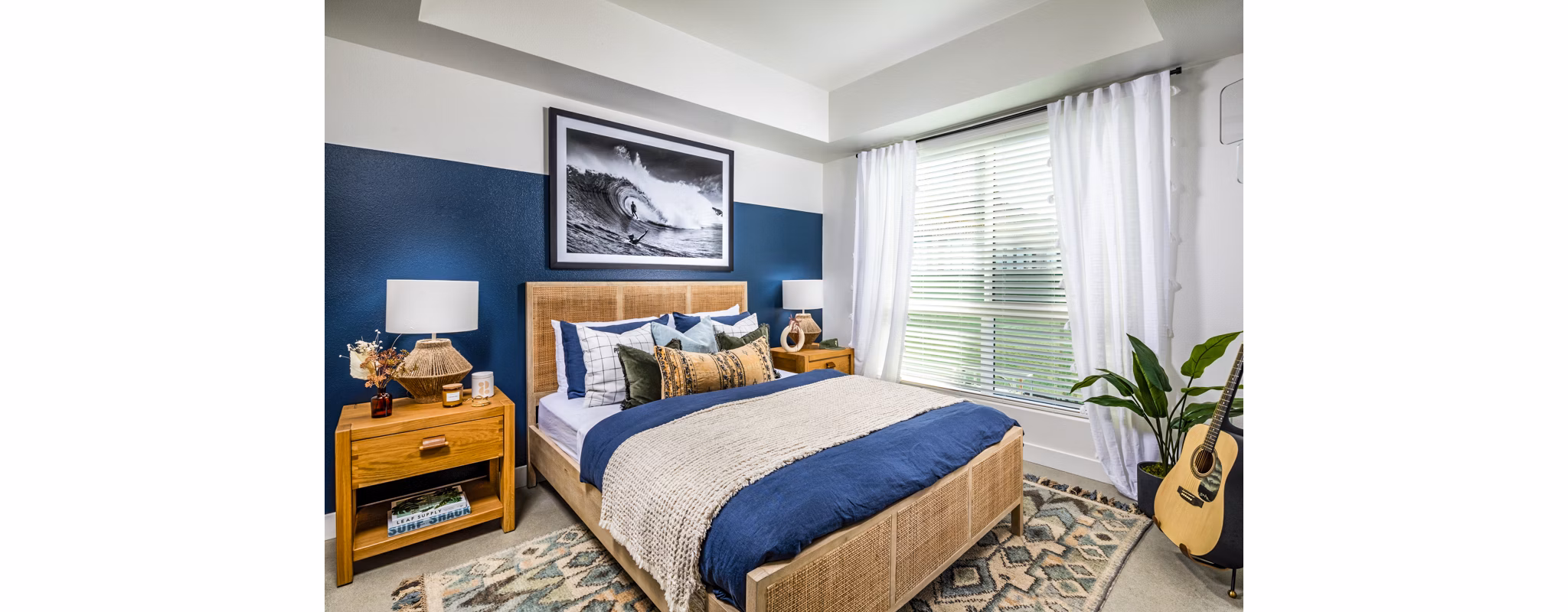 Cozy bedroom with modern furnishings at Silo Apartments, a luxury Greystar community