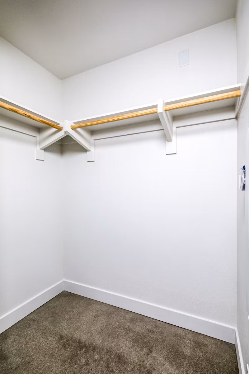 Spacious bedroom closet with ample shelving in Silo Apartments