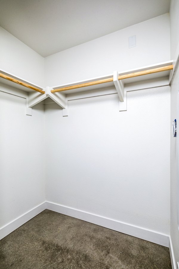 Spacious bedroom closet with ample shelving in Silo Apartments