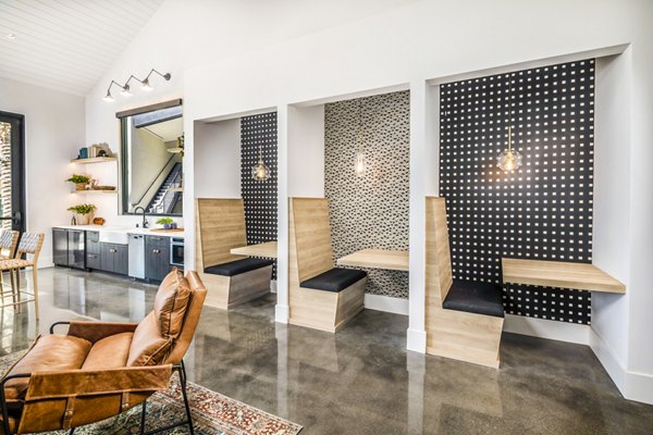 Clubhouse with modern decor and seating at Silo Apartments, offering luxurious social spaces for residents