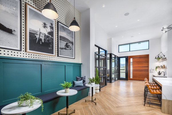 Clubhouse with modern decor and lounge seating at Silo Apartments, a Greystar luxury community