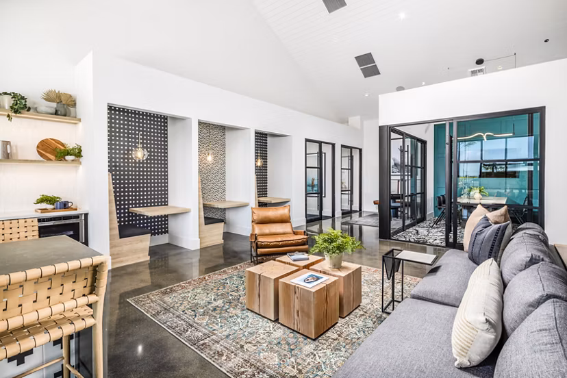 Modern clubhouse with sleek furniture and open layout at Silo Apartments, showcasing luxury living in a premier Greystar community
