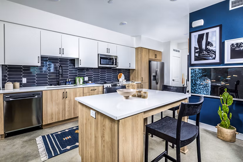 Dining area with modern kitchen fixtures at Silo Apartments, part of Greystar's luxury apartment collection