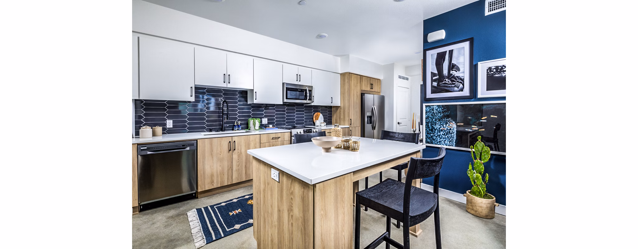 Dining area with modern kitchen fixtures at Silo Apartments, part of Greystar's luxury apartment collection