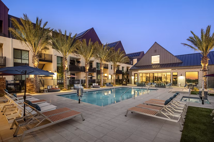 Silo Apartments: Luxurious outdoor pool with lounge chairs in a serene setting