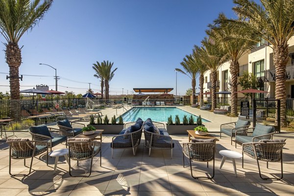 Silo Apartments: Modern outdoor pool area with lounging space at luxury apartments