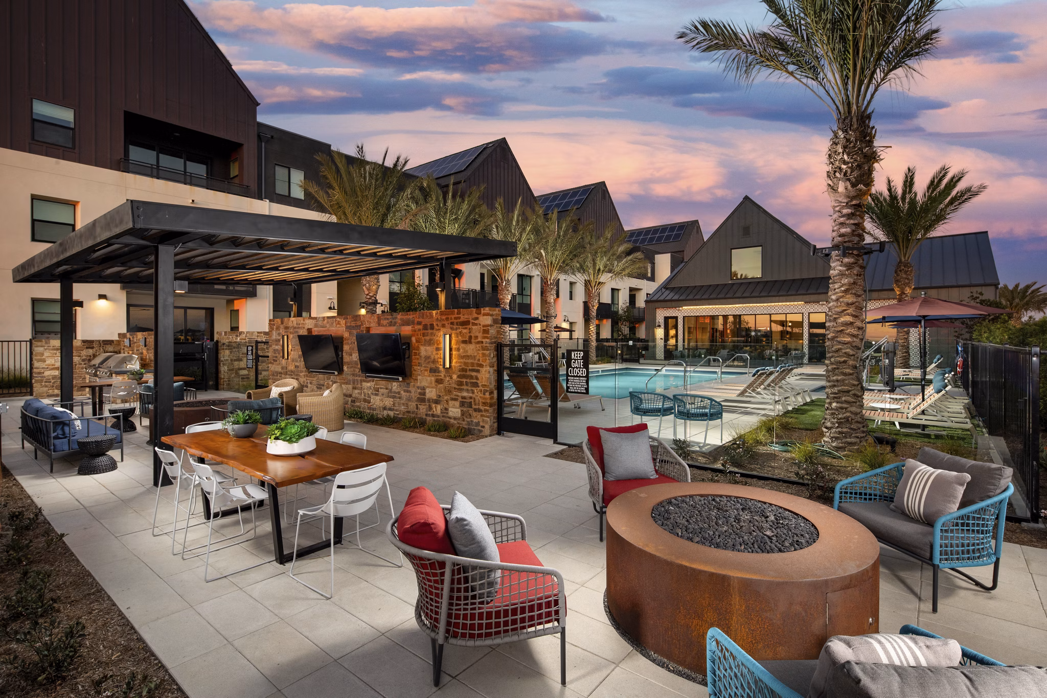 Fire pit lounge area with cozy seating at Silo Apartments, a luxury community by Greystar Perfect for outdoor gatherings and relaxation